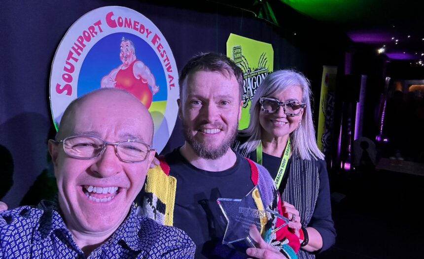 Southport New Comedian Of The Year 2025 Winner Rich McCulloch with Isabelle Kent from Dragon Soop and Festival Director Bren Riley