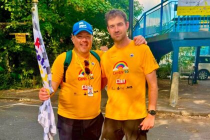 Fundraising champion Alex Rigby (right) has raised £30 for the Centre 56 charity through his Running the Railways - On The Hour challenge. He is pictured with Greg Suligowski from Merseyrail, which supported his fundraiser