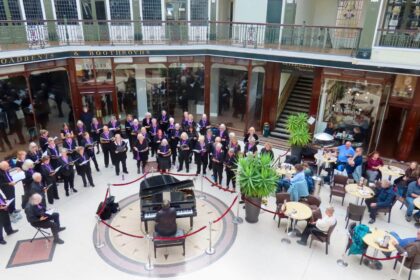 The SingMe Merseyside Choir led by Billy Hui BEM entertained shoppers at Wayfarers Arcade in Southport. Photo by Andrew Brown Stand Up For Southport