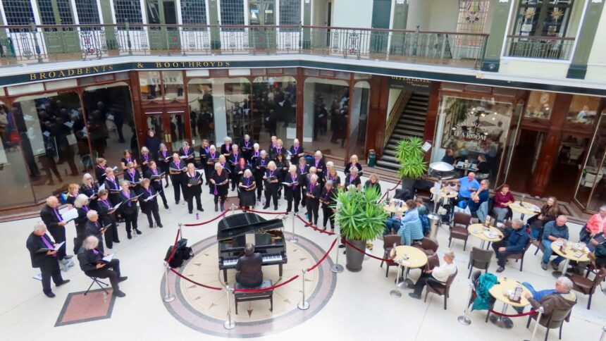 The SingMe Merseyside Choir led by Billy Hui BEM entertained shoppers at Wayfarers Arcade in Southport. Photo by Andrew Brown Stand Up For Southport