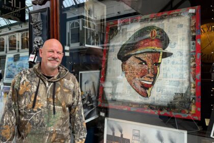Artist Grant Searl with his Local Hero painting featuring Dan Dare from Eagle comic at his Grand Searl & The Northerner Art Gallery at Wayfarers Arcade in Southport. Photo by Andrew Brown Stand Up For Southport