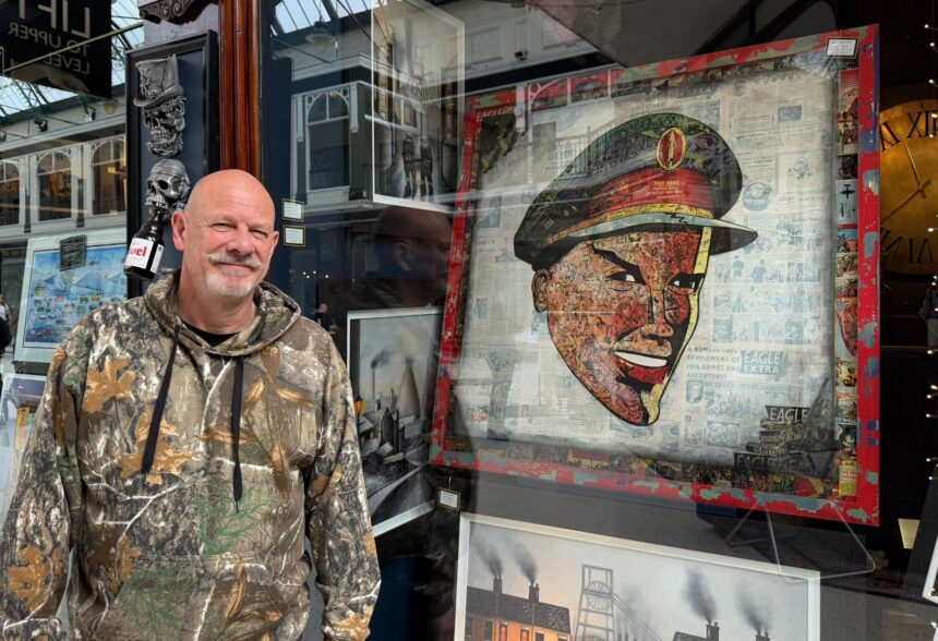 Artist Grant Searl with his Local Hero painting featuring Dan Dare from Eagle comic at his Grand Searl & The Northerner Art Gallery at Wayfarers Arcade in Southport. Photo by Andrew Brown Stand Up For Southport