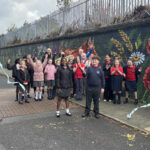 The longest mural in the UK has been completed by Paul Curtis at Cinder Path in Bootle as part of Sefton's School Neighbourhood project