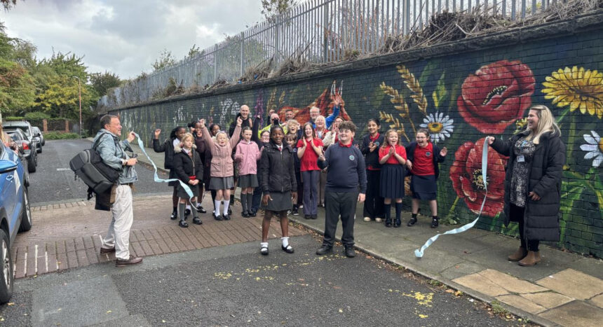 The longest mural in the UK has been completed by Paul Curtis at Cinder Path in Bootle as part of Sefton's School Neighbourhood project