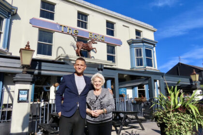 The new Talkin' Tables initiative is coming to The Bold on Lord Street in Southport. Mikhail Hotel And Leisure Group Cluster Manager James Bretnall-Bennett with Dorothy Livesey from Talkin' Tables. Photo by Andrew Brown Stand Up For Southport